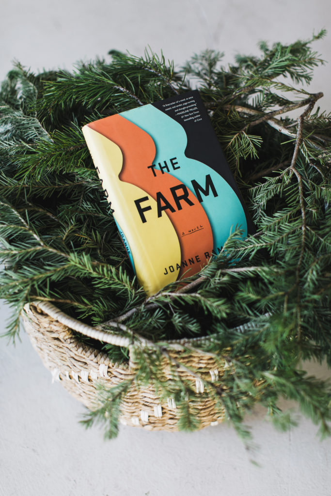 The Farm book by Joanne Ramos evergreen branches in basket